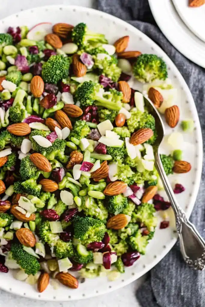 Served broccoli salad on plate with dressing and toppings