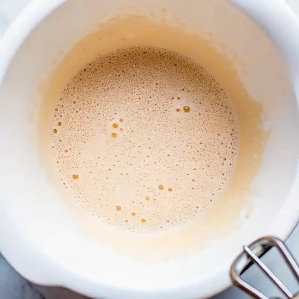 folding flour and cocoa into the chocolate mixture